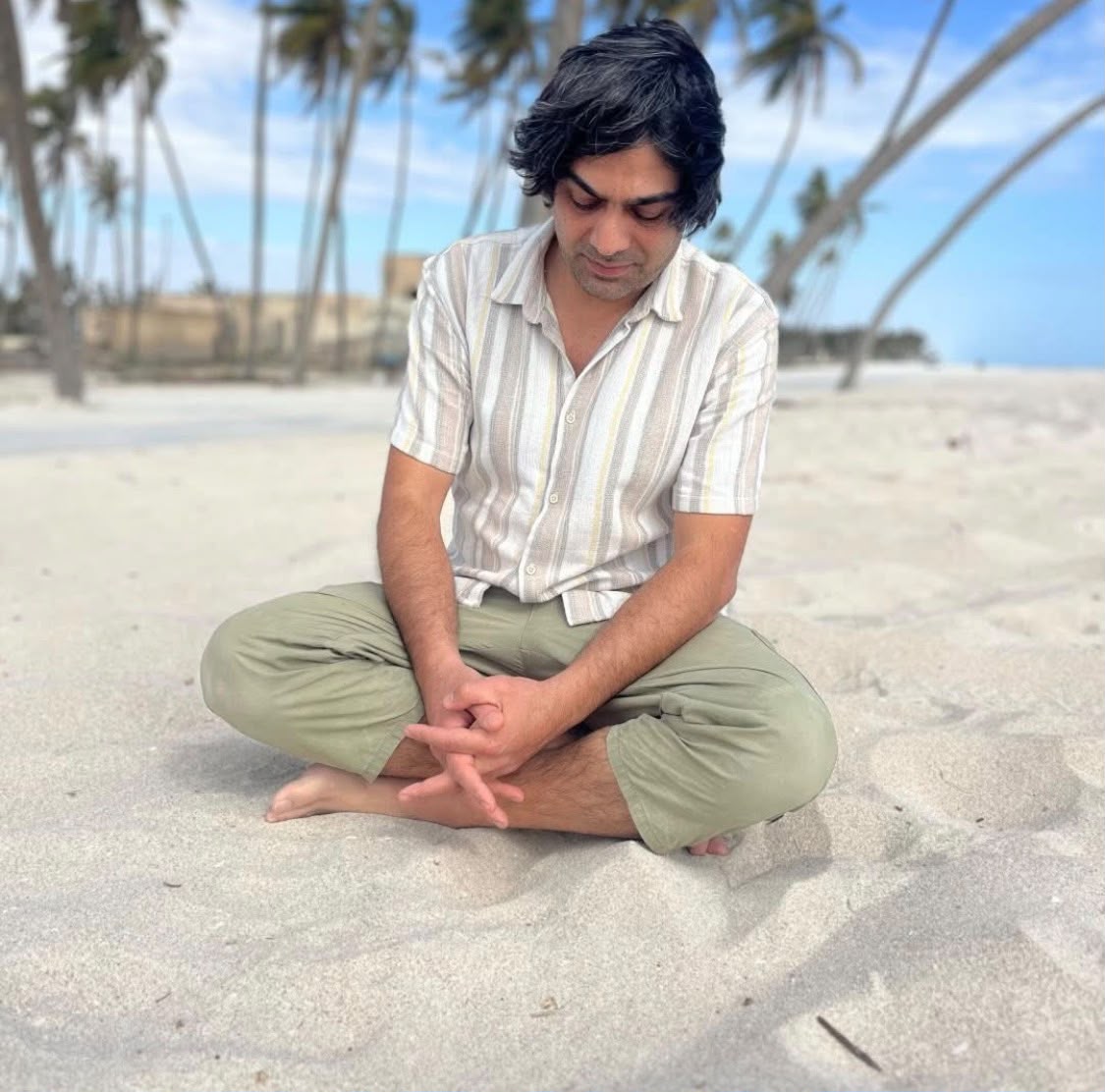 Murat seated on a quiet beach