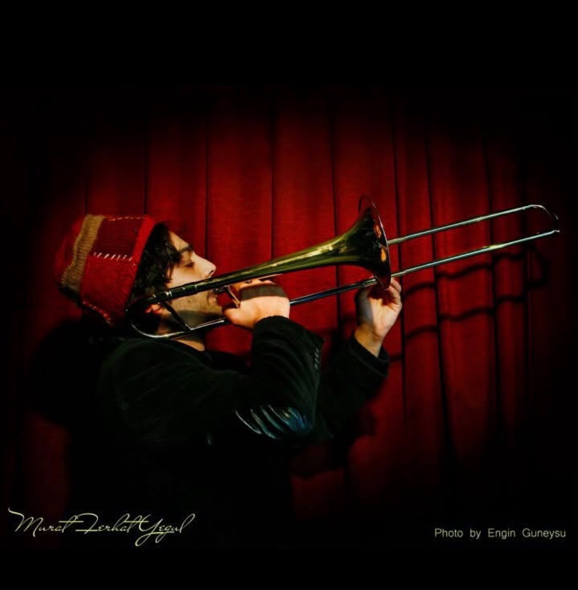 Murat playing trombone on stage