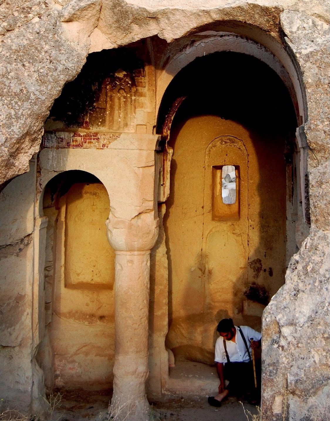 Murat exploring a historic stone interior